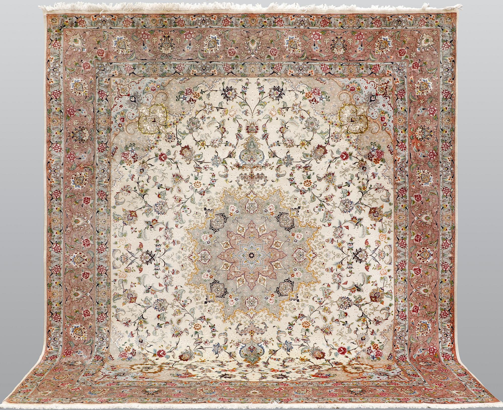A Tabriz part silk carpet, 297 x 253 cm.