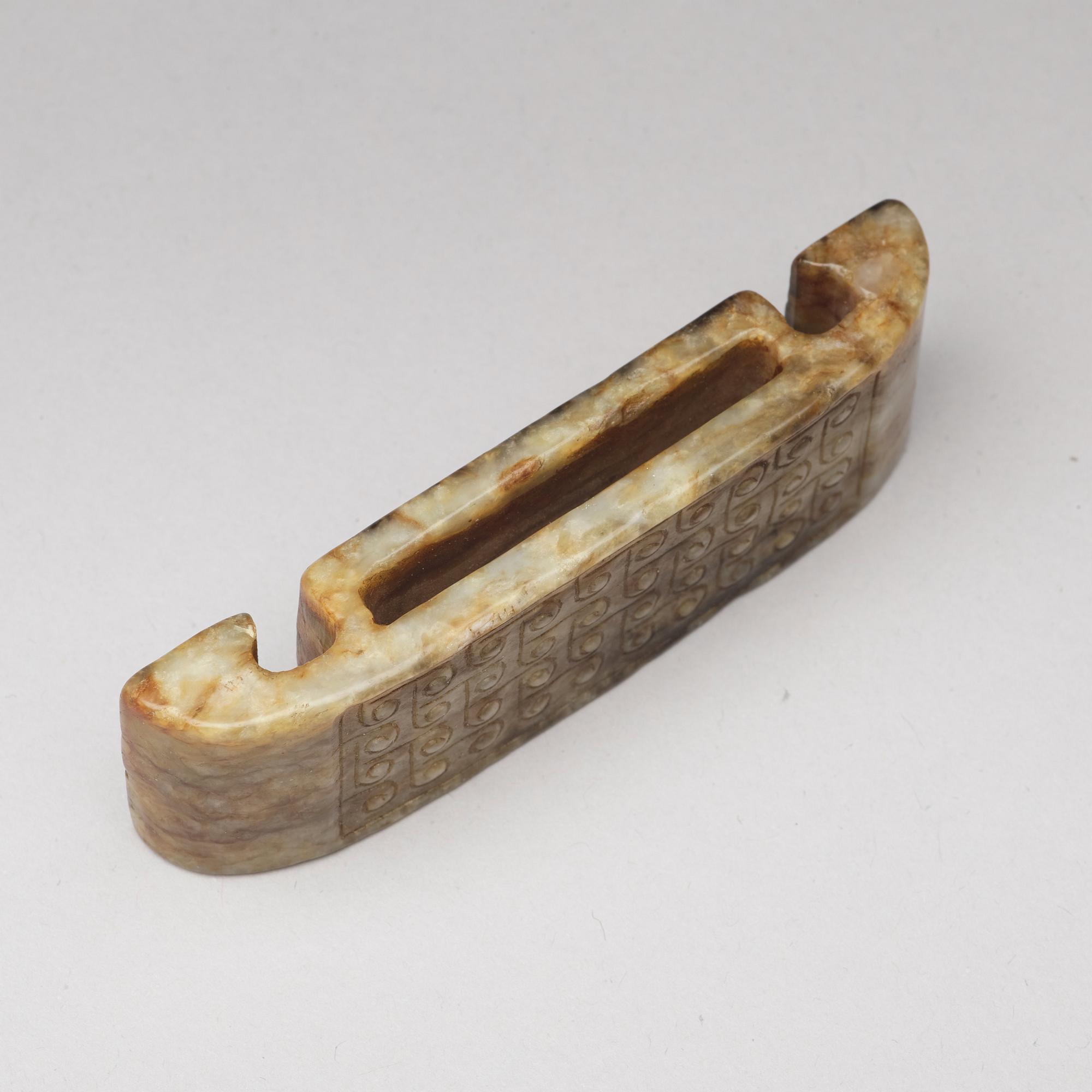 A nephrite scabbard, archaistic.