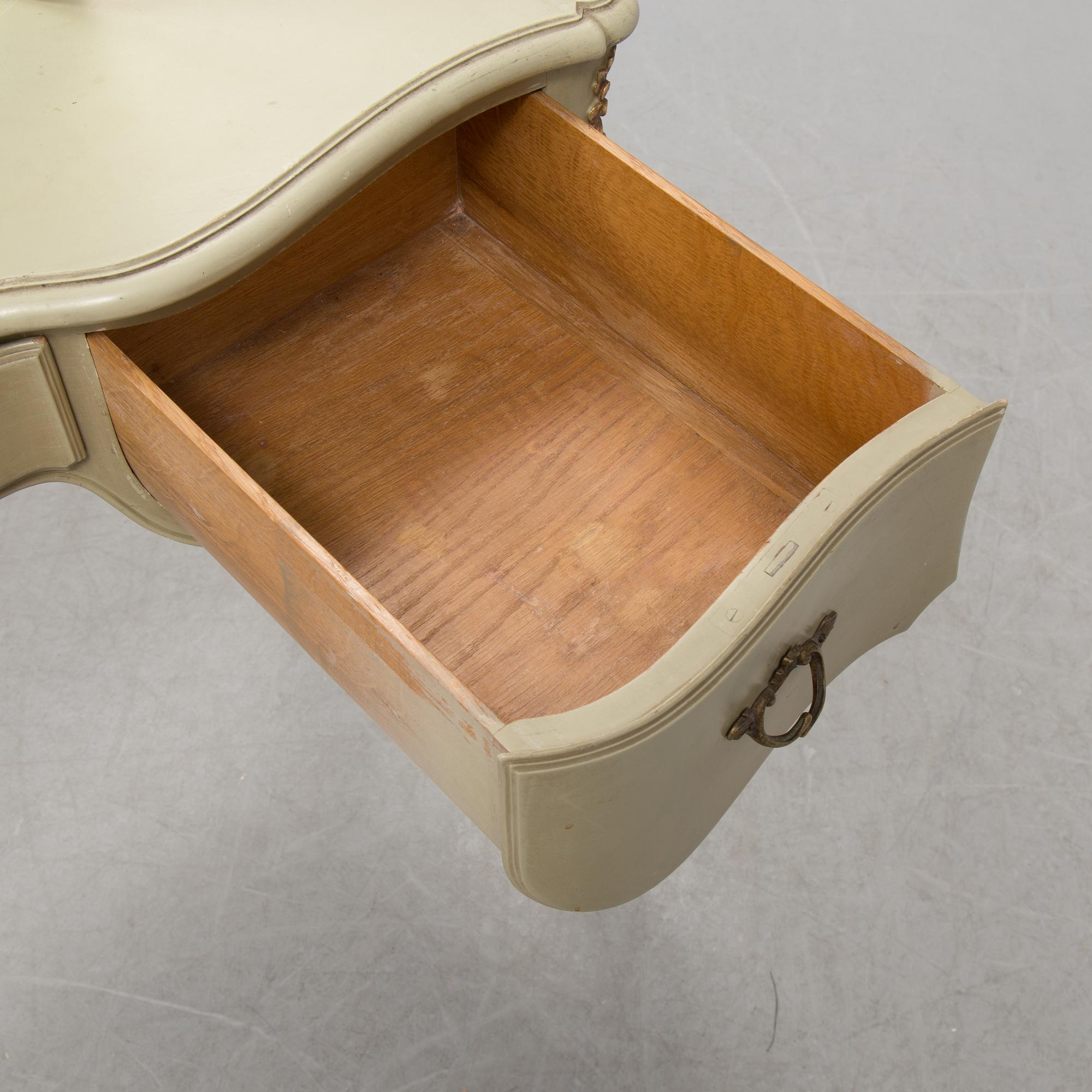 A mid 20th century Rococo style dressing table, a pair of bedside tables and one stool.