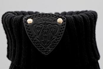 A pair of black boots from Gucci.