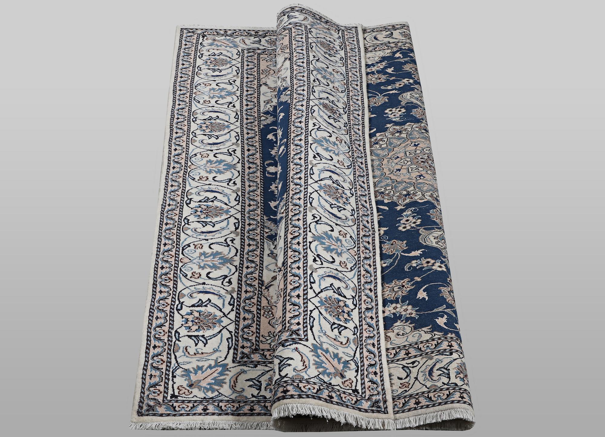 A carpet, Nain, part silk, ca 294 x 198 cm.