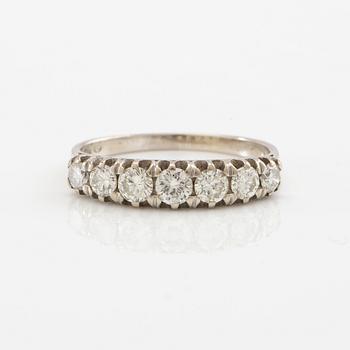 Half-eternity ring in 18K white gold set with round brilliant-cut diamonds, approximately 0.93 ct in total.