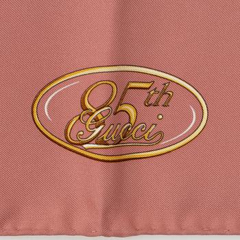 Gucci, a silk scarf.