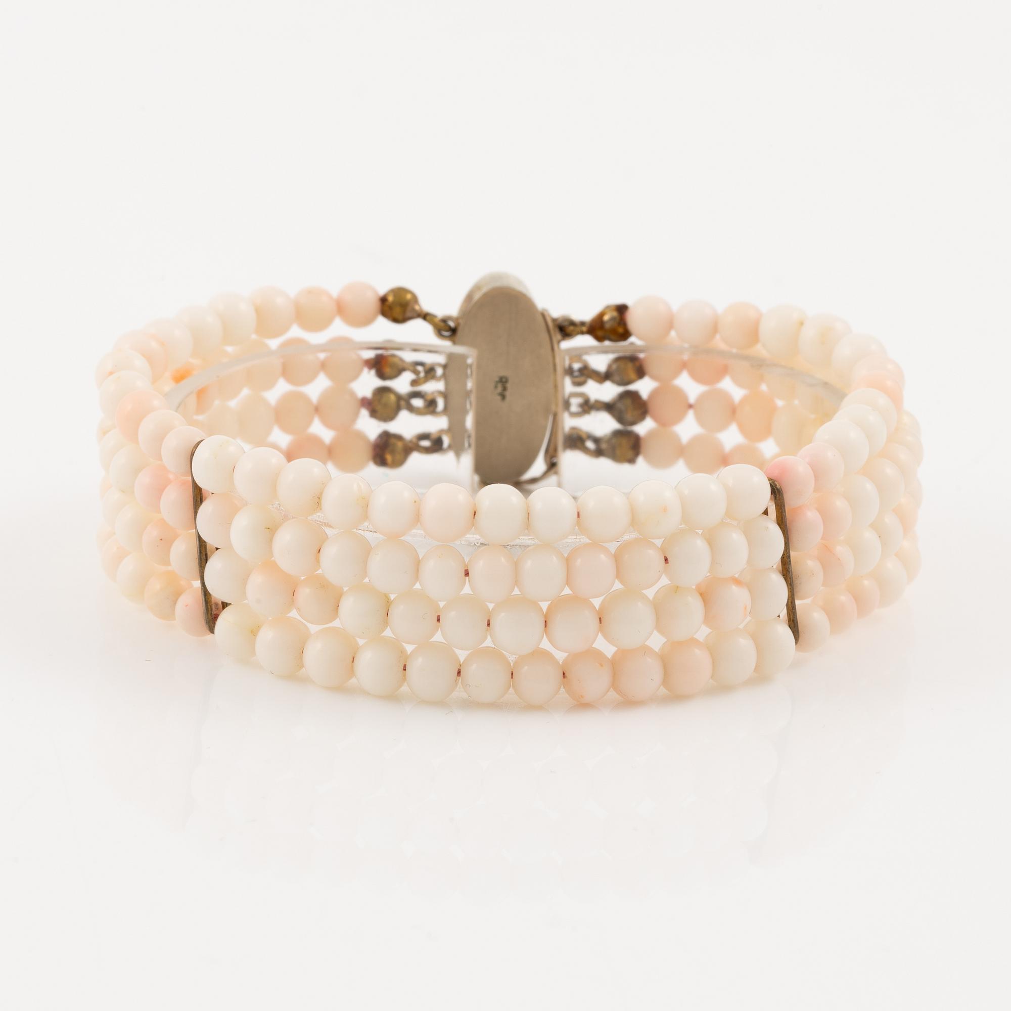 Bracelet with light pink coral, four strands.