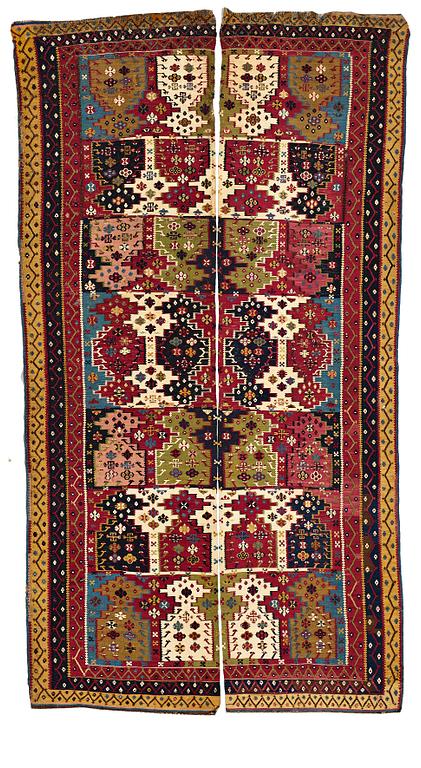 A KILIM, two parts, an antique Reyhanlı, south east Anatolia, ca 290,5 x 79,5 cm and ca 289 x 76 cm.