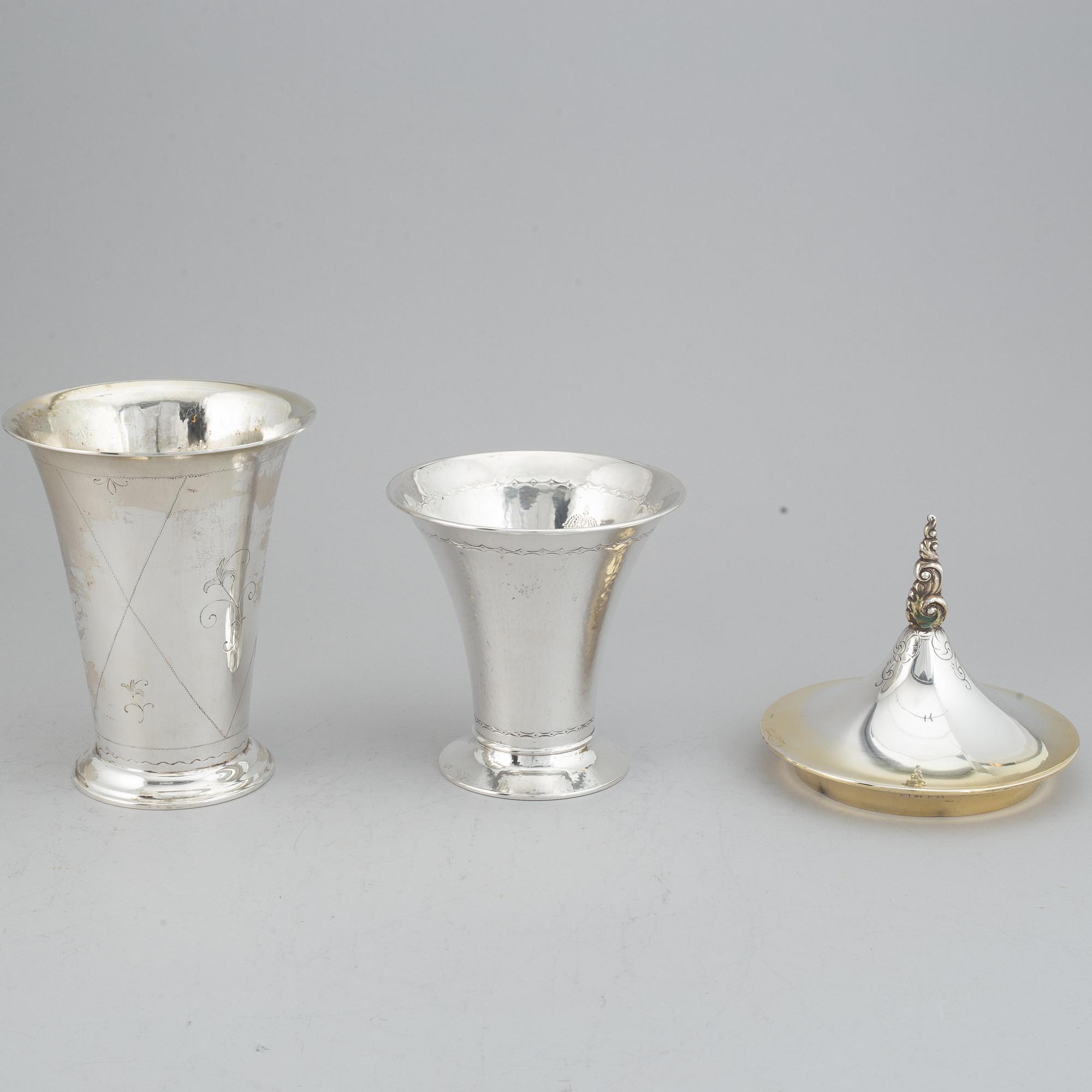 Two silver and parcel-gilt beakers and a parcel-gilt lid, maker's mark K. Andersson, Stockholm, 1927, 1922 and 1948.