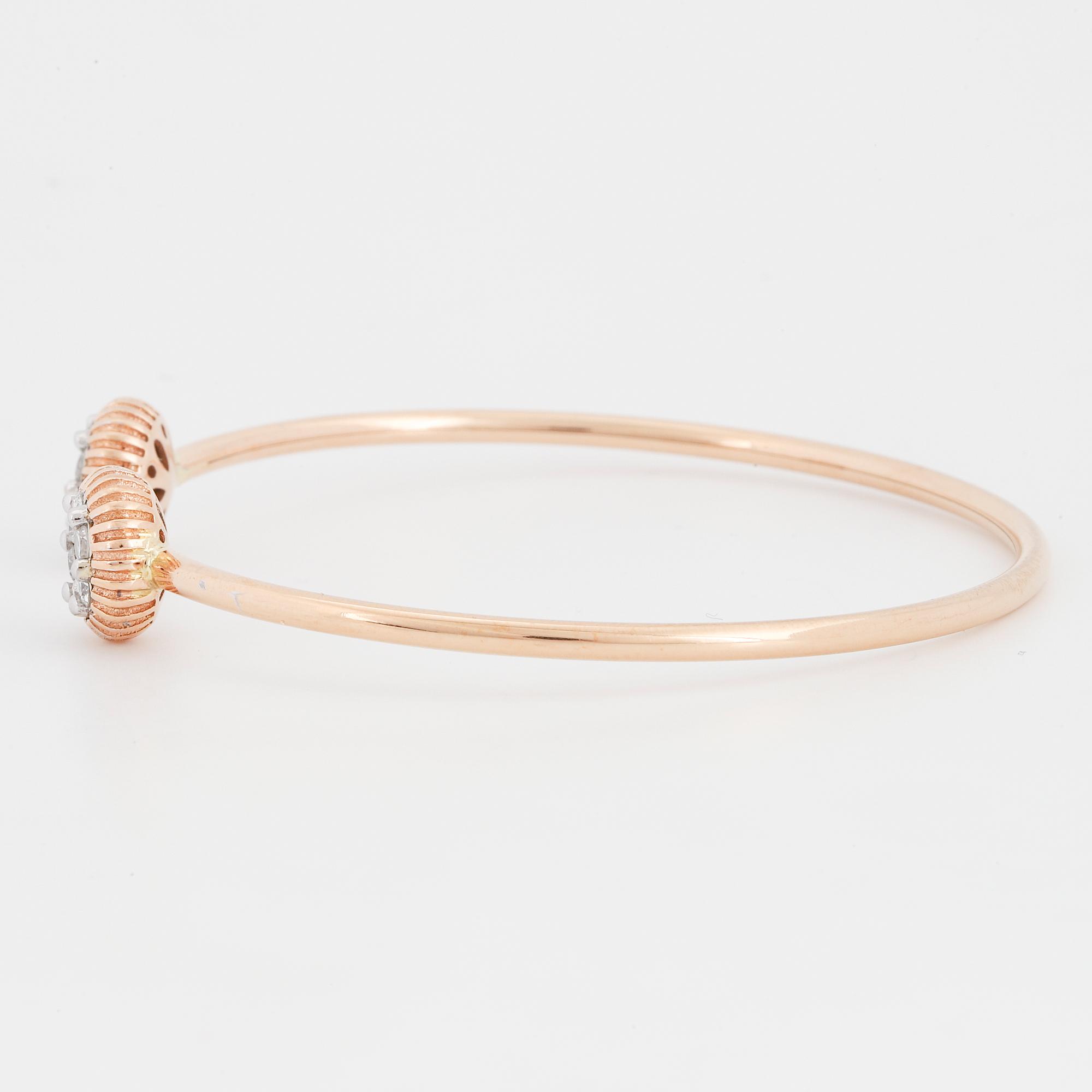 An 18K rose gold bracelet set with round brilliant-cut diamonds.