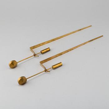 PIERRE FORSSELL, "Pendeln", a pair, brass, Skultuna. Second half of the 20th century.