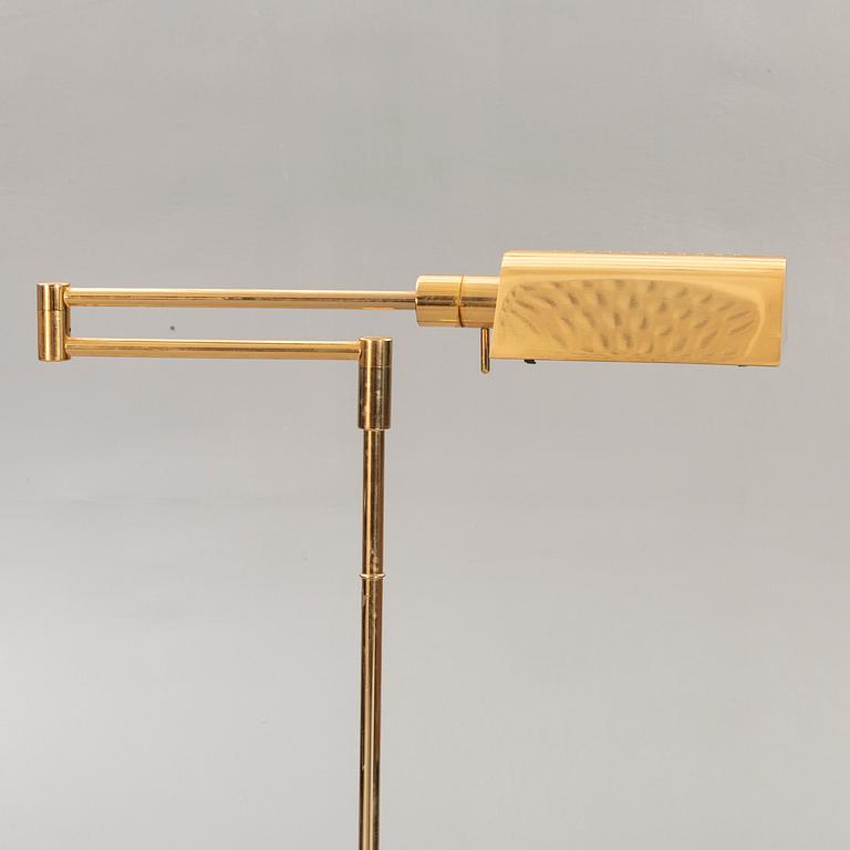 A brass floor lamp later part of the 20th century.