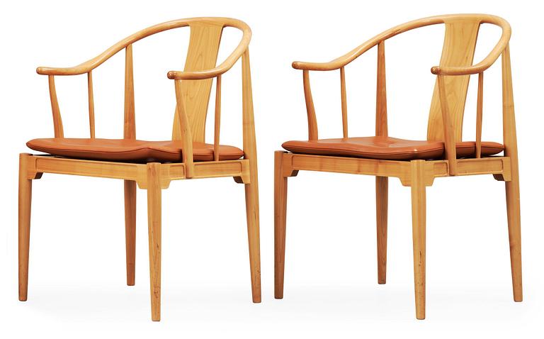 A pair of Hans J Wegner cherry and brown leather 'China chairs', Fritz Hansen, Denmark 1989.