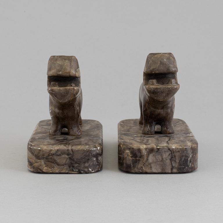 A pair of stone book ends, early 20th century.