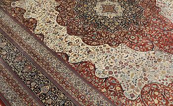 An Oriental silk carpet, c. 436 x 306 cm.