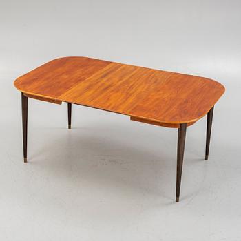 A teak-veneered dining table, mid 20th century.