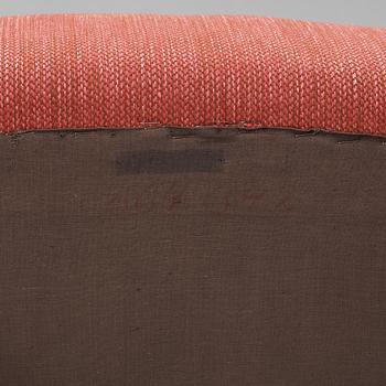 A chair "Lilla Adam" by Kerstin Hörlin-Holmquist.