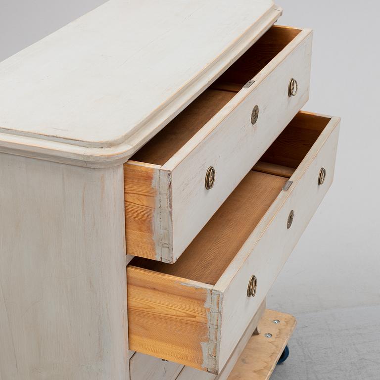 A painted chest of drawers, 19th Century.