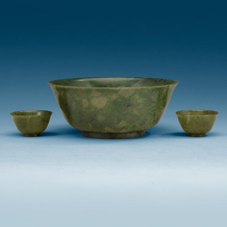 A Chinese green stone bowl and two winecups.