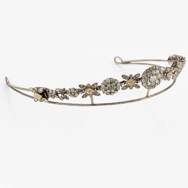 A silver and paste demi parure comprising a tiara and a pair of earrings, 19th century.