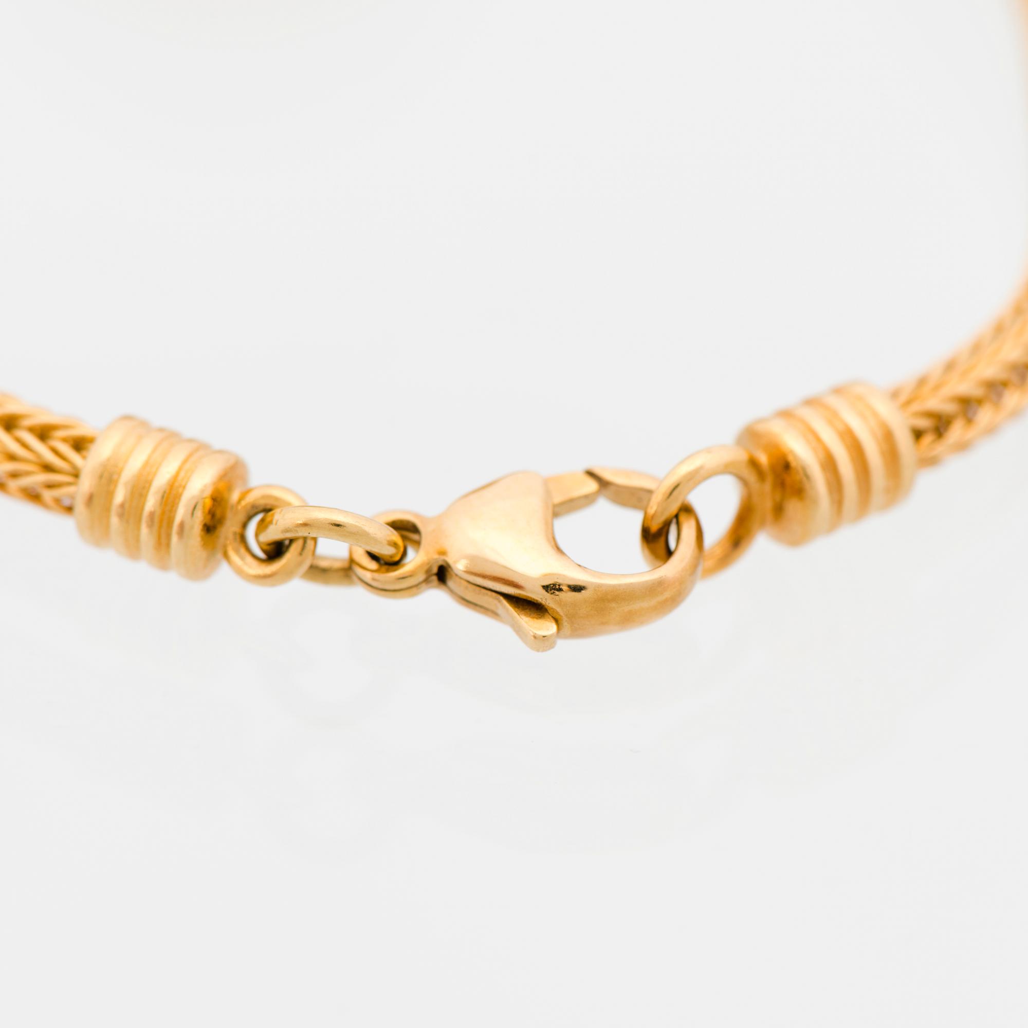 ARMBAND, "Sollejonet", 18K guld. Kalevala Koru 1999.