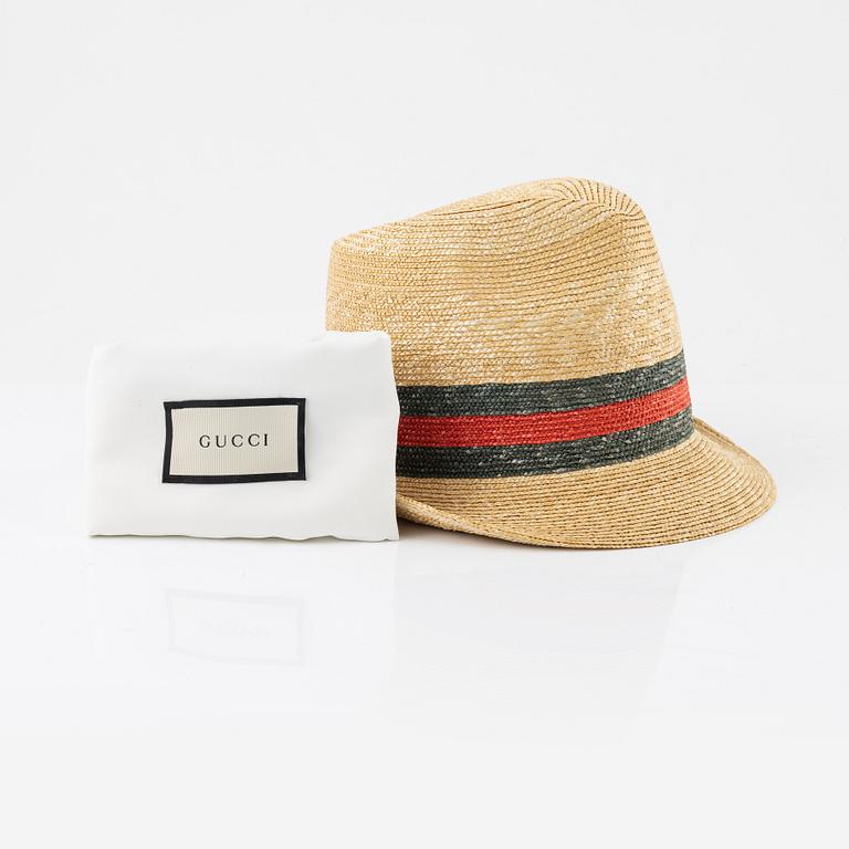 Gucci, a straw hat, size M.