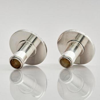 Georg Jensen, a pair of sterling silver candlesticks, design by Sigvard Bernadotte, model no 711A, Copenhagen, Denmark after 1945.