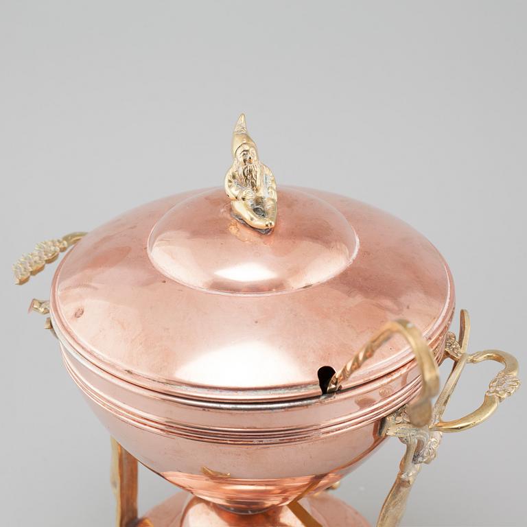 An early 20th century mulled wine heater.