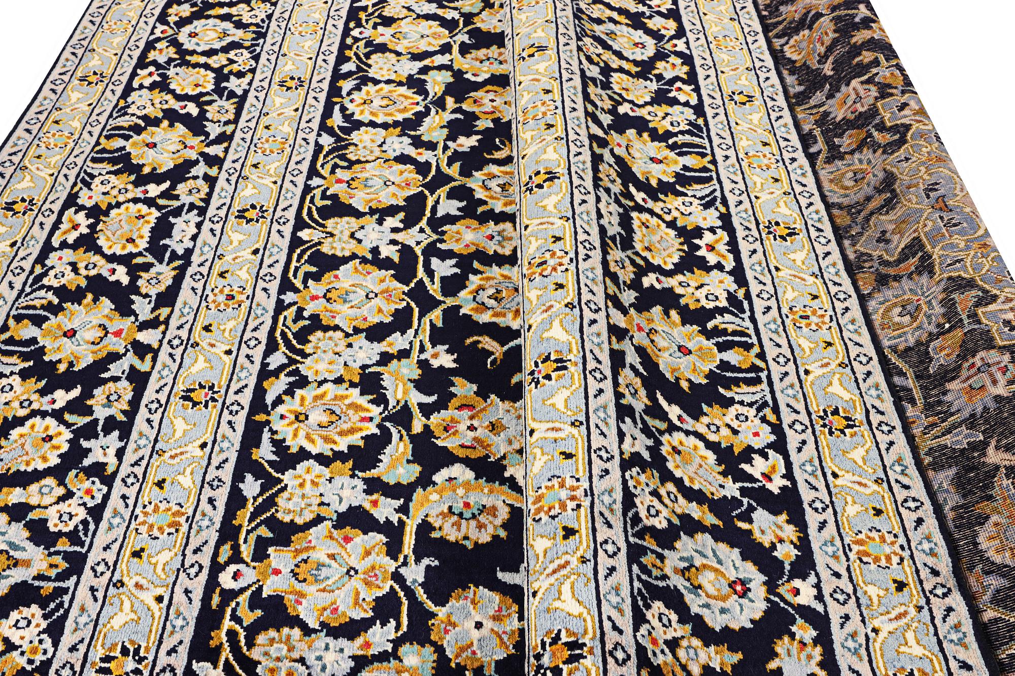 A Kashan carpet, c. 365 x 259 cm.