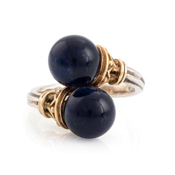 An Ilias Lalaounis ring in silver and 18K gold with sodalite.