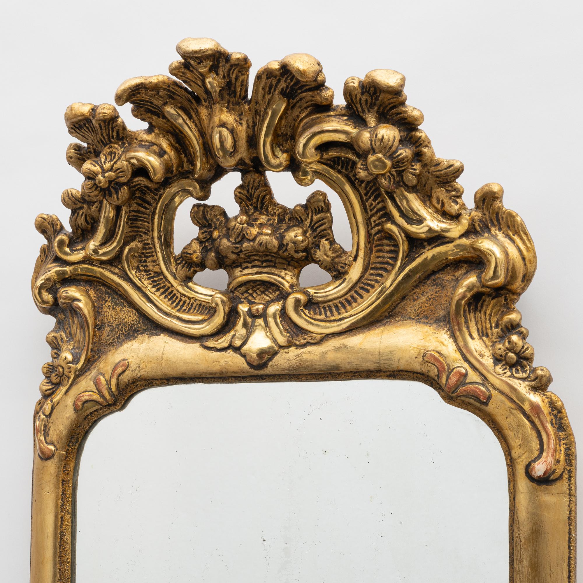 A Swedish rococo two-branch girandole mirror, Stockholm, later part 18th century.