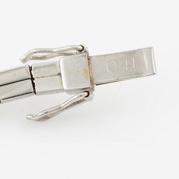 Bracelet, 18K white gold set with seven brilliant-cut diamonds.