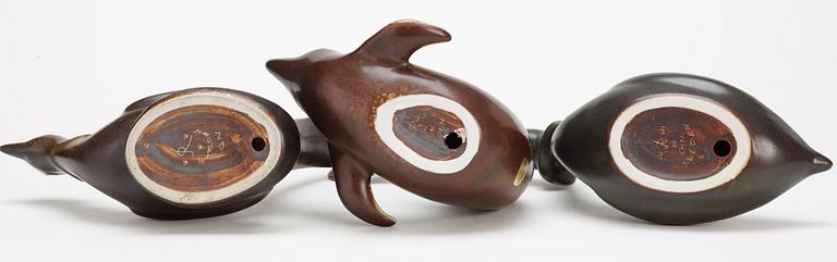 Three Gunnar Nylund stoneware figures, a dolphin, a pheasant and a great crested grebe, Rörstrand.