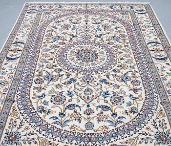 A carpet, Nain, part silk, ca 296 x 192 cm.
