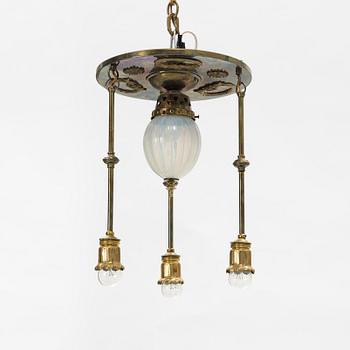 An Art Nouveau brass and glass table light, early 20th Century.