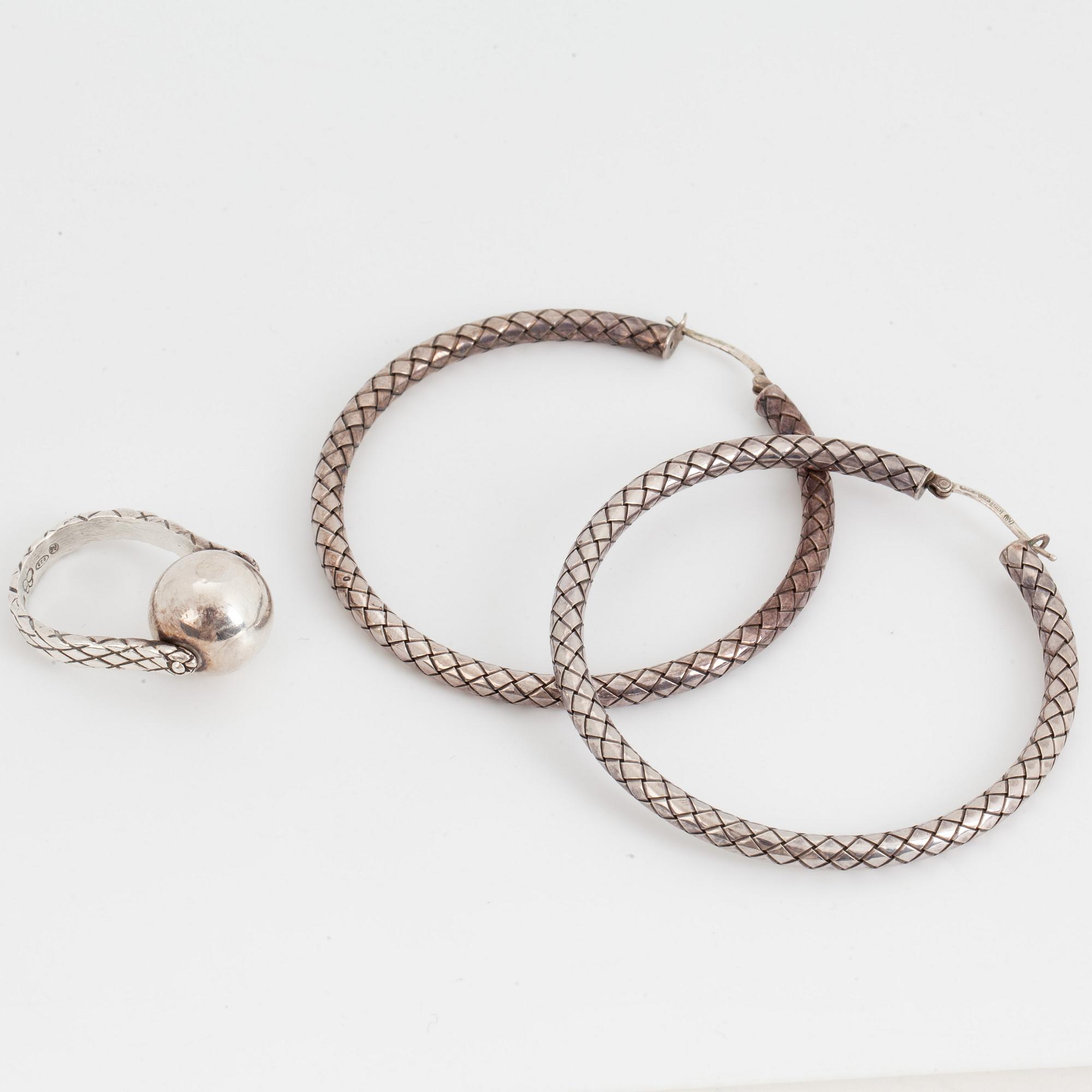 BOTTEGA VENETA, a pair of silver earrings and a silver ring.