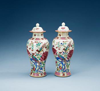 1449. A pair of famille rose vases with covers, Qing dynasty (1736-95).
