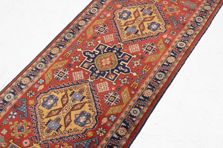 A semi-antique Kurdish runner, 350 x 140 cm.