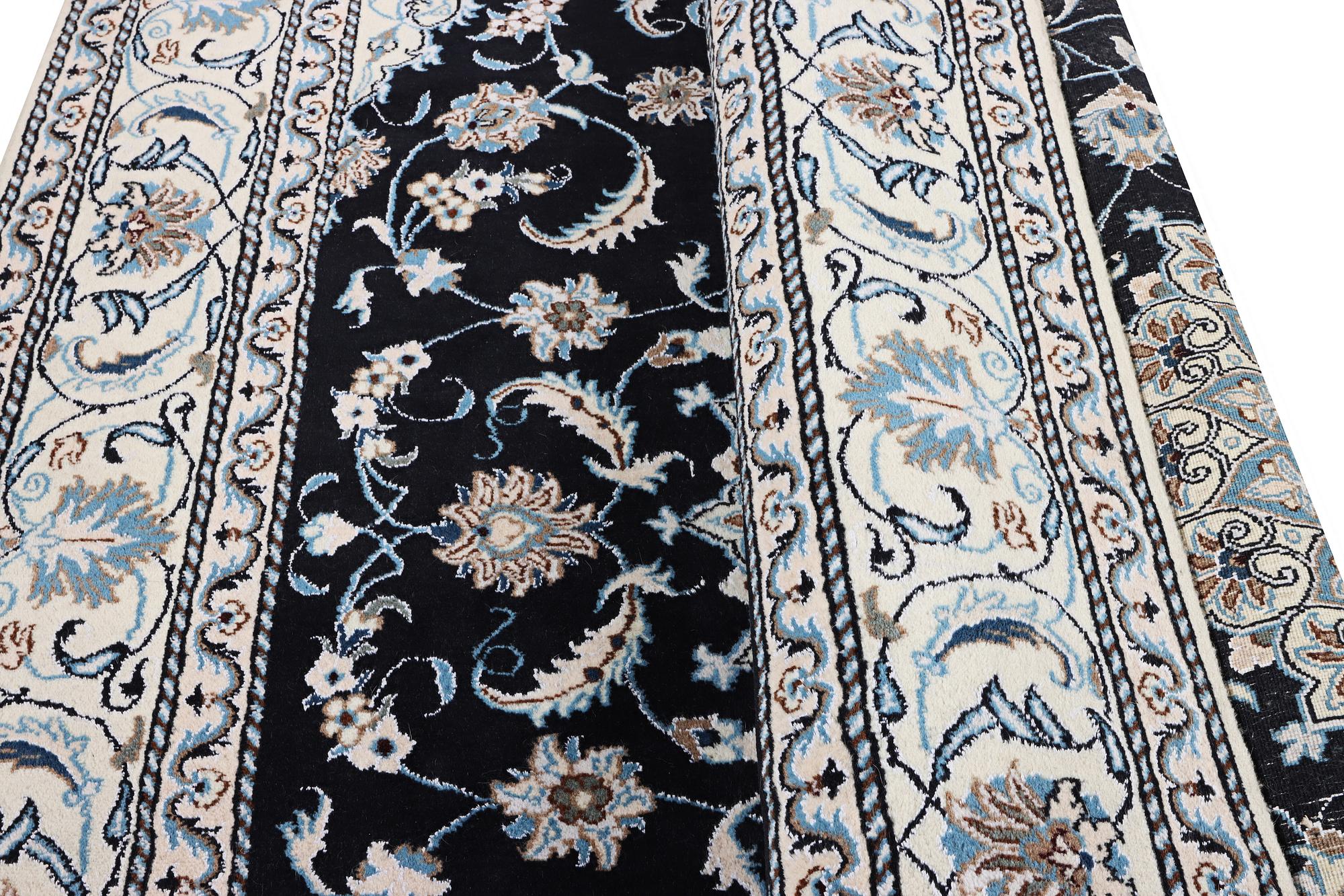 A Nain carpet, part silk, c. 286 x 206 cm.
