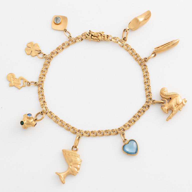 Armband med berlocker 18K guld.