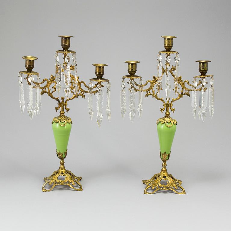 A pair of late 19th Century gilt candelabra.