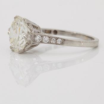 A SOLITAIRE RING with an old-cut diamond 2.56 cts.