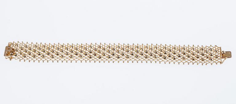 ARMSMYCKE, 18K guld. 1900-talets senare hälft. Vikt 19,3 g.