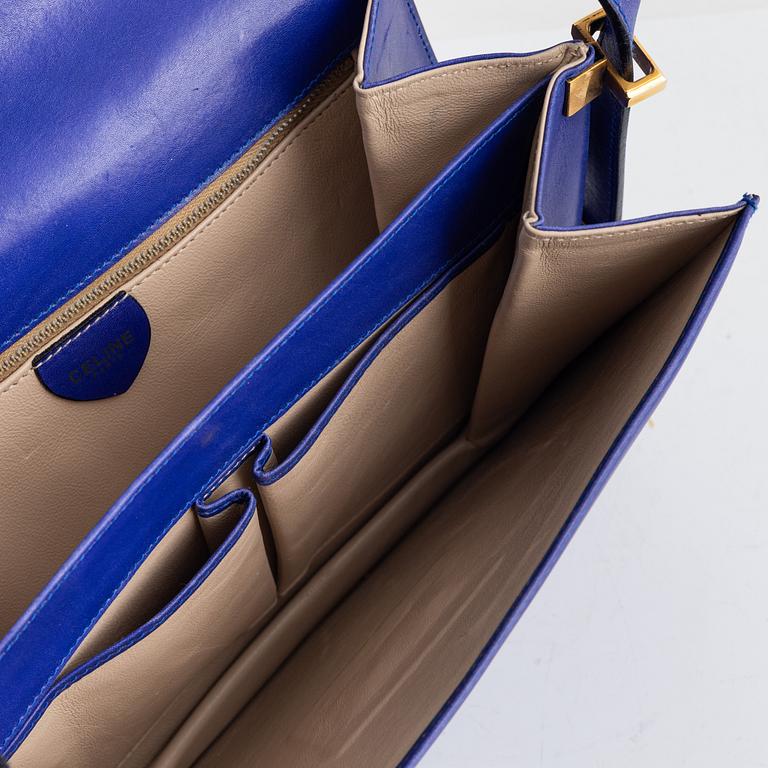 Céline, a blue leather bag.