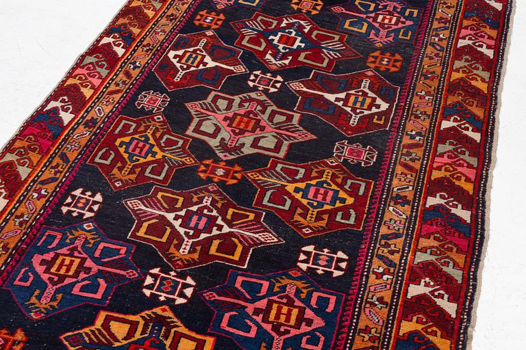 A semi-antique Anatolian runner, c. 409 x 159 cm.