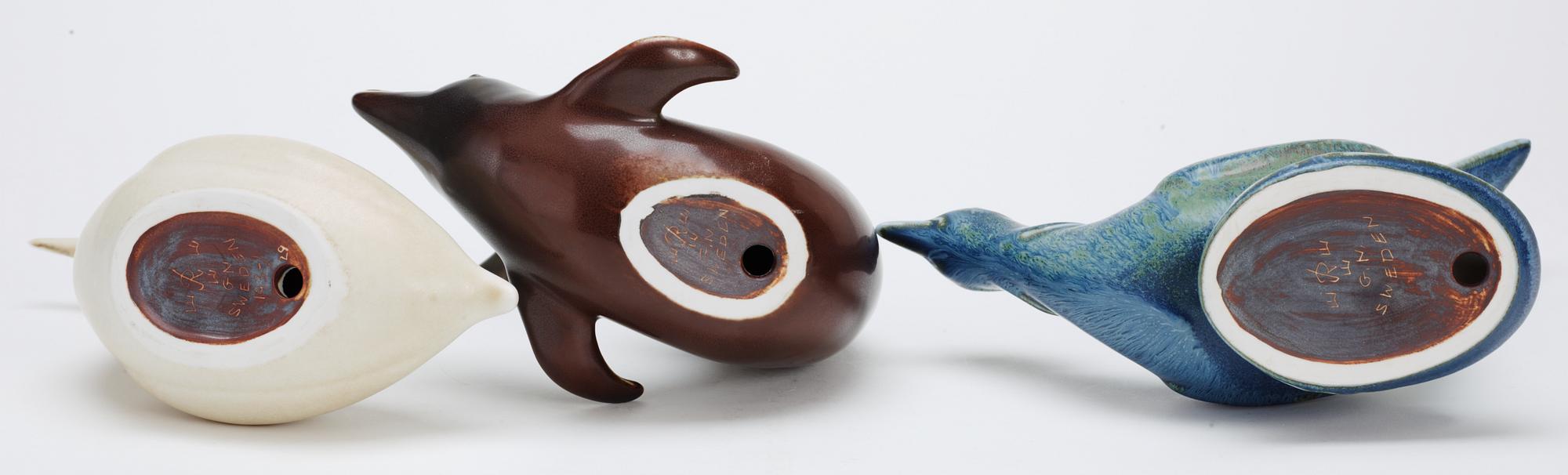 Three Gunnar Nylund stoneware figures, a dolphin, a pheasant and a great crested grebe, Rörstrand.