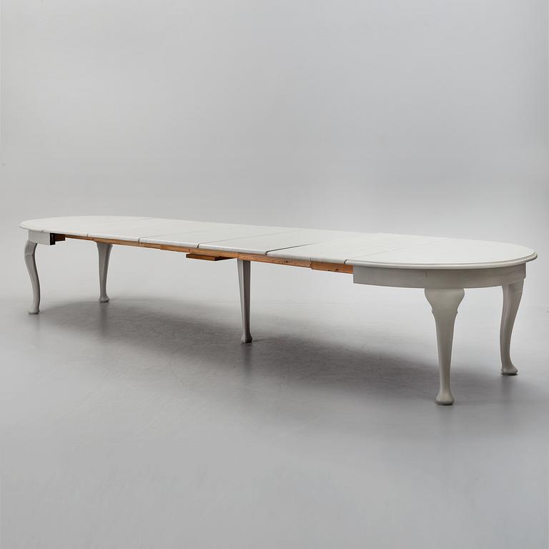 A painted Rococo style dining table, circa 1900.