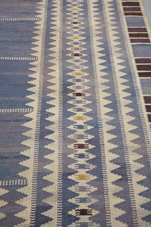 Barbro Nilsson, a carpet, "Salerno blå", flat weave, ca 312 x 201,5-205,5 cm, signed AB MMF BN.