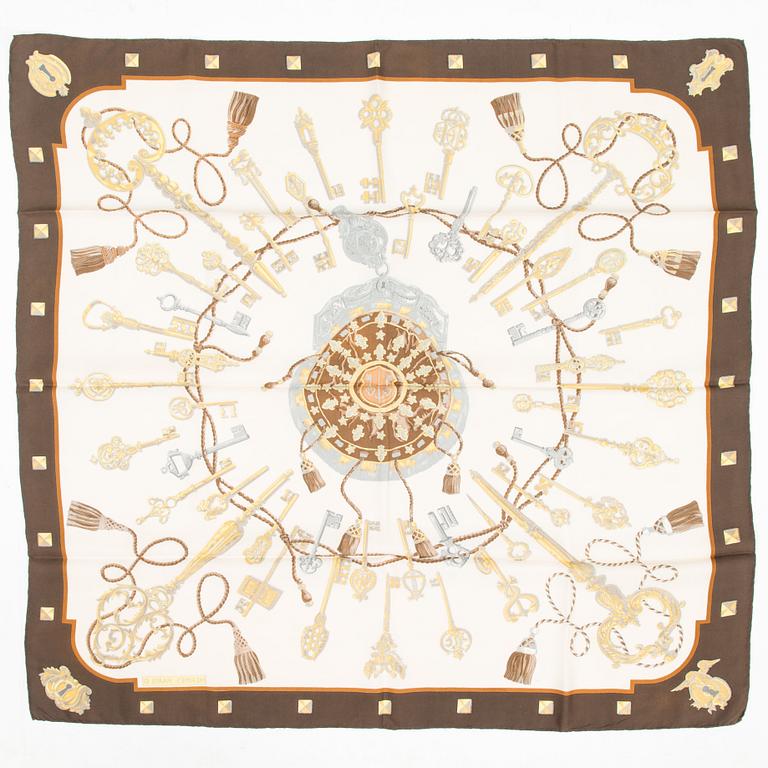 Hermès, Two silk scarves, 'Les Voitures a Transformation' and 'Les Clefs'.