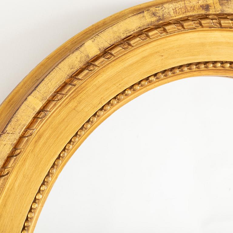 A 20th century gustavian style mirror.