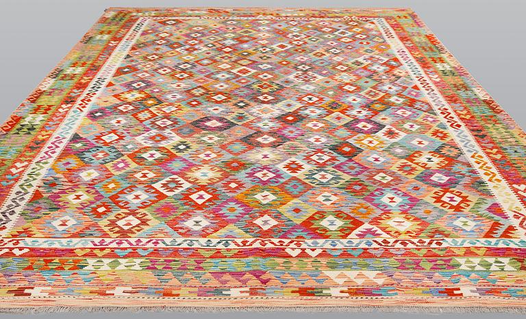 A kilim carpet, c 394 x 305 cm.