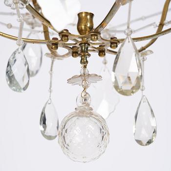 A seven-light gilt brass and cut glass rococo chandelier, mid 18th century.