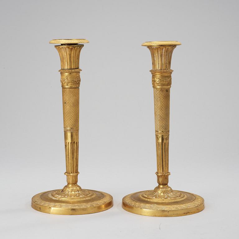 A pair of French Empire early 19th century candlesticks.